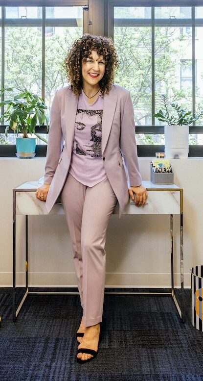 Photo of Jill Sammak standing in her office